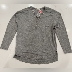 Women’s size small button long sleeve shirt.